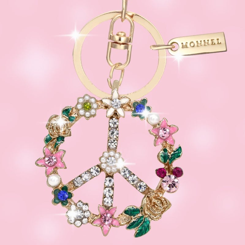 Monnel حلقة مفاتيح مونييل بتصميم زهرة كريستالية لامعة مع علامة السلام، تعبئة إبداعية مع حقيبة مخملية MZ843-1 - Image 2